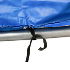 Close-up of black tie strap fastening on blue trampoline pad edge