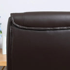Brown faux leather chair backrest with visible seam stitching along the panel