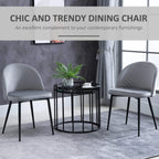 Set of 2 grey dining chairs with arched backs and black tapered metal legs
