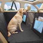 Black dog car hammock seat cover with blue pocket panel and mesh side section