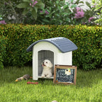 Outdoor dog kennel with dark grey roof and white plastic walls, open front doorway