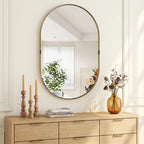 Gold-tone oval wall mirror with thin raised frame and centered round glass