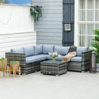 Grey rattan corner sofa set on patio with light-blue seat cushions and glass-top table