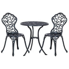 Black metal bistro dining set with round table and two ornate lattice chairs