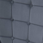 Dark grey upholstered wingback chair back panel with round button tufting