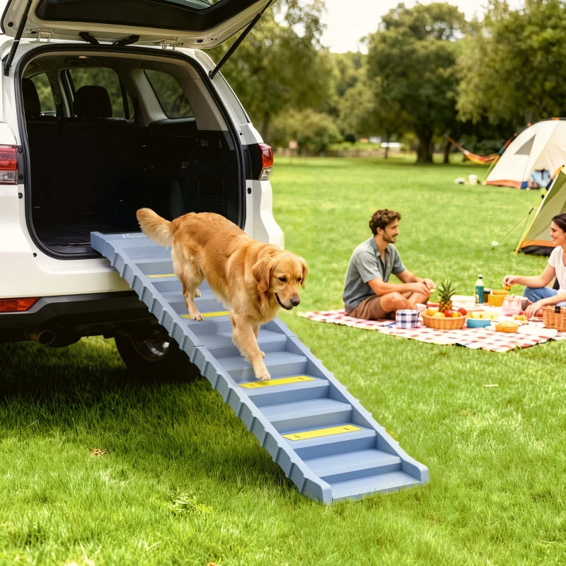 Grey dog car ramp with 10 steps and yellow anti-slip treads extending from a trunk