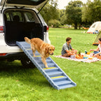 Grey dog car ramp with 10 steps and yellow anti-slip treads extending from a trunk