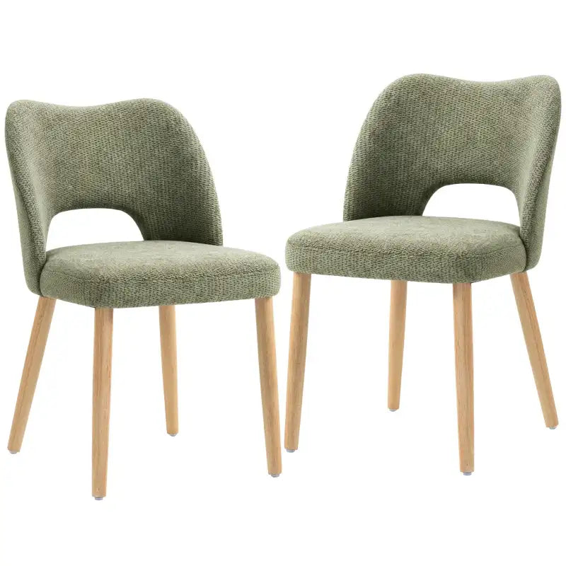 Set of 2 green upholstered dining chairs with curved backs, foam seats, and light wood legs