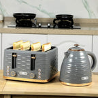 Grey four-slice toaster with toasting bread and rapid-boil kettle on counter