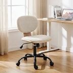 Light grey upholstered office rocking chair with round back, swivel base, and caster wheels.