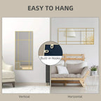 Gold-tone grid wall mirror with built-in back hooks for easy hanging.
