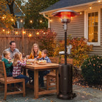 Brown gas patio heater standing beside outdoor dining table
