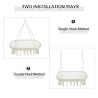 Cream hanging macrame hammock chair with oval net seat, fringe tassels, and hooks