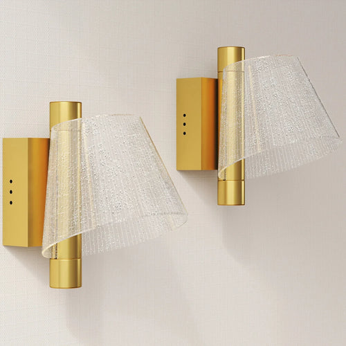 Gold-tone LED wall lamp pair with white textured starry shades and cylindrical backplates
