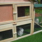 Close-up of wire mesh door on wooden guinea pig hutch with slide latch and handle