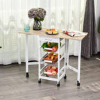 White rolling kitchen cart with oak top and wire baskets, holding fruit and pantry items