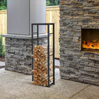 Black metal firewood log holder rack with stacked logs inside, open vertical frame
