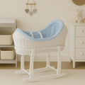 White wicker baby moses basket with stand and light blue textured bedding