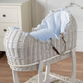 White wicker Moses basket with light blue padded liner and textured fabric cover