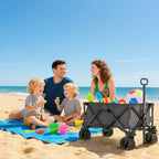 Dark grey folding pull-along cargo wagon trailer on beach with all-terrain wheels