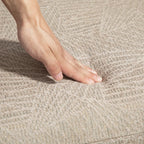 Khaki upholstered recliner chair fabric texture close-up