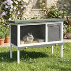 Grey wooden rabbit hutch with wire front and dark door, bunny inside