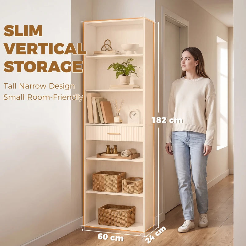 White slim vertical tall bookshelf with open shelves and drawer, next to person