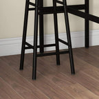 Close-up of industrial bar stool legs and cross-brace frame with black metal feet