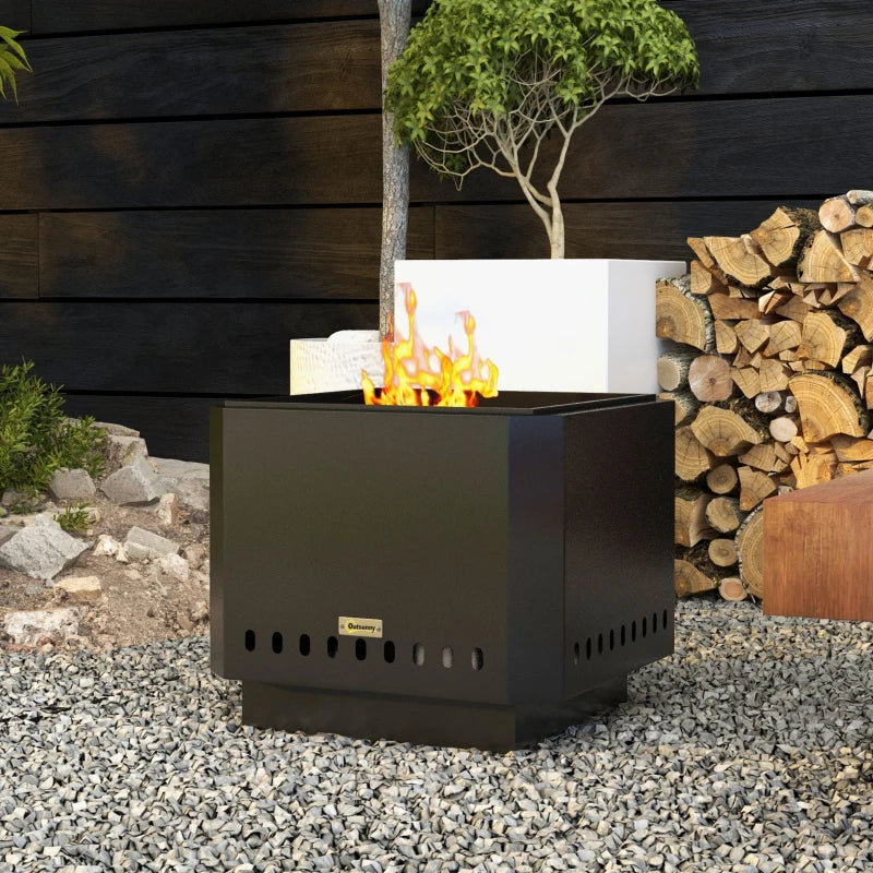 Black square metal fire pit with open top and vent holes, burning flame outdoors