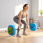 Barbell on wooden floor with multicolour plates and straight black grip bar
