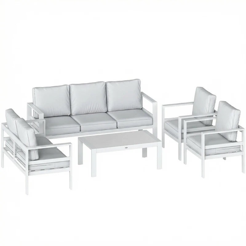 White outdoor sofa set with gray cushions, matching armchairs, and rectangular coffee table