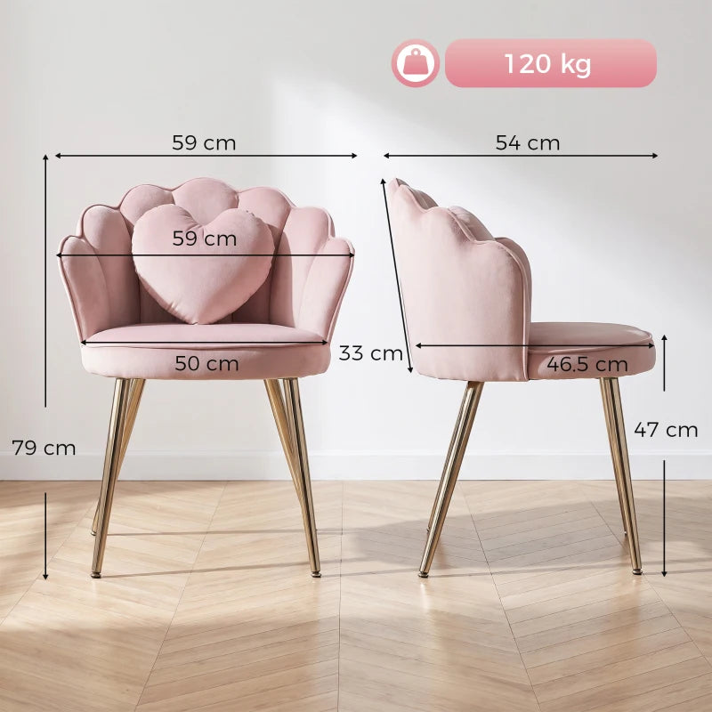 Pink velvet armchair with curved armrests, heart pillow, and gold-tone metal legs