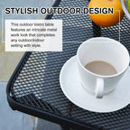 Black mesh tabletop with coffee cup on a square outdoor bistro table