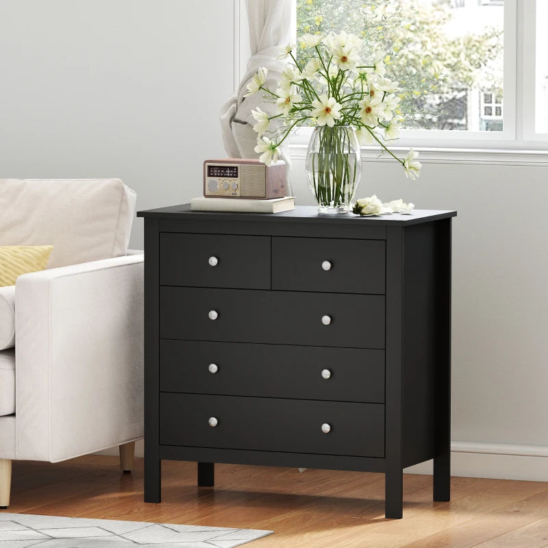 Black dresser with five drawers and round metal knobs