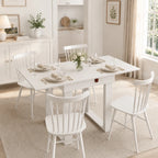 White folding dining table with chairs around and side under storage rail