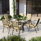 Beige cushioned armchairs around a black square dining table with umbrella hole
