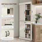 White cupboard with open doors showing shelves and drawer with black handle accents