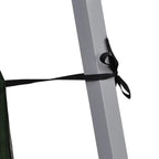 Green pop-up gazebo canopy with black tie strap securing to the steel frame pole