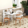 White folding drop-leaf dining table with built-in shelves, styled with chairs in a room