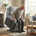 Light grey corduroy electric lift recliner chair side view with black base