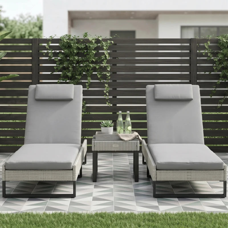Light grey PE rattan sun lounger set with two chairs and side table on patio