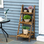 Brown wooden 3-tier folding flower pot stand on outdoor patio with four planters