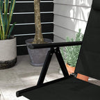 Black padded folding garden chair with armrest and angled backrest