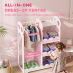 Kids pink dress-up wardrobe with hanging rail, open shelves, and bottom storage compartment