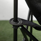 Black folding camping chair with non-slip foot pad on steel leg and fabric edge