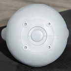 Gray 4 kg kettlebell flat base underside with screw holes