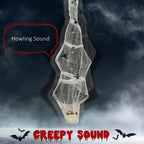 Hanging grey mummy decoration with glowing eyes and spider web wrap
