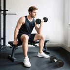 Black hex rubber dumbbells, 6 kg each, gripped for a shoulder press workout