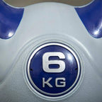 6 kg kettlebell close-up of round weight badge on grey body with purple handle