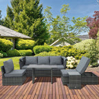 Gray outdoor rattan sofa set with canopy, reclining seats, and side tables on deck